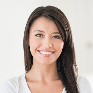 Smiling woman after cosmetic dentistry