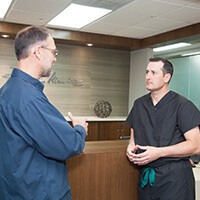 Dr. Rodney addressing concerned patient