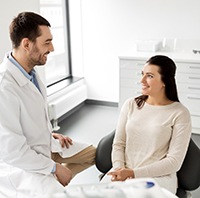 Dentist explaining how dental implants work