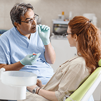 Woman talking to dentist