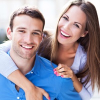 Man and woman smiling outdoors