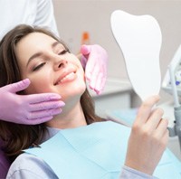 A woman seeing the results of cosmetic dentistry 
