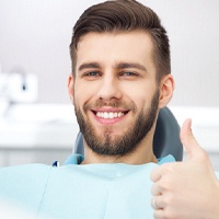 Man in dental chair for preventive services.