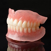 Full dentures can replace an entire arch of lost teeth