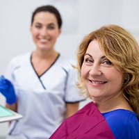 Woman visiting an implant dentist for care