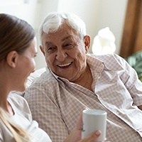 Woman visiting an implant dentist for care