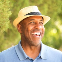 man standing among the trees healthy smile thanks to periodontal therapy