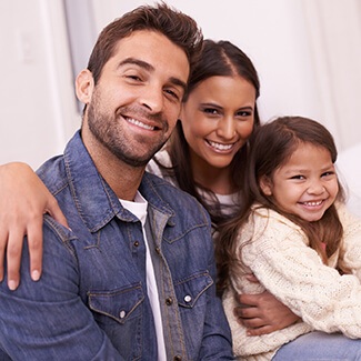 Family smiling thanks to preventive dentistry