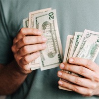 Man’s hands counting cash