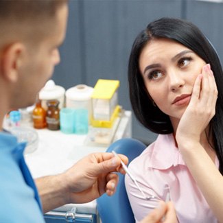 A woman about to receive a root canal from her dentist