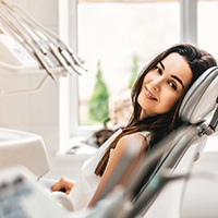 Woman comfortable in dental chair at sedation dentist.
