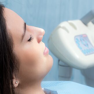 Relaxed woman with eyes closed after receiving sedation dentistry in Parker Colorado