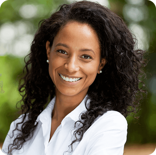 Dark haired woman in white collared shirt smiling
