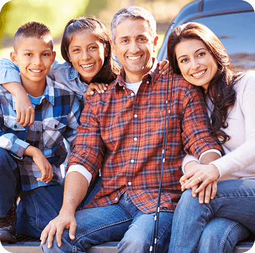 Happy family of four camping
