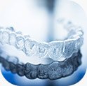 Clear Invisalign aligner on table