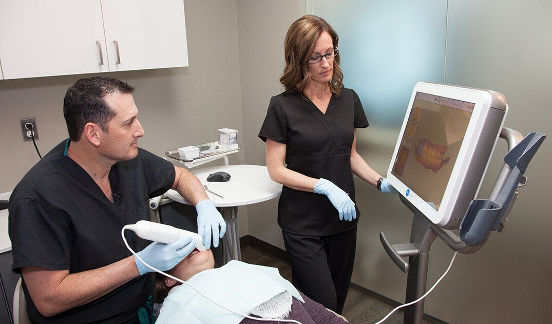 Dentist examining a dental patient