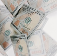 $100 bills representing the cost of veneers