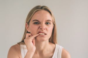 woman dealing with oral health problems