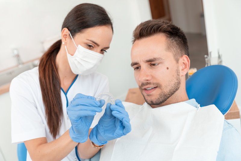 Man at dentist getting Invisalign in Parker