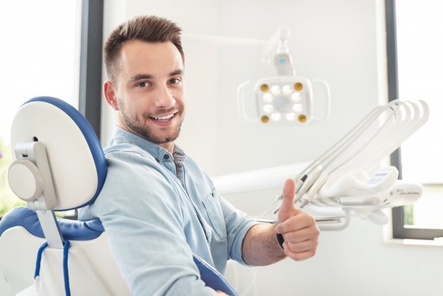 Patient at the dentist’s office receiving interproximal reduction.