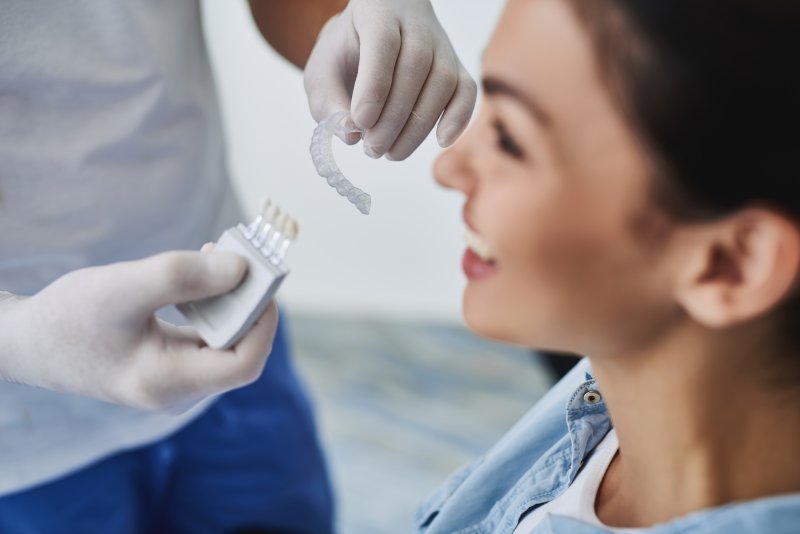 A dentist telling a patient about the Invisalign timeline