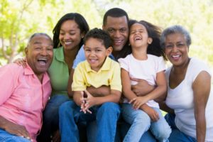 many generations of a family smiling together